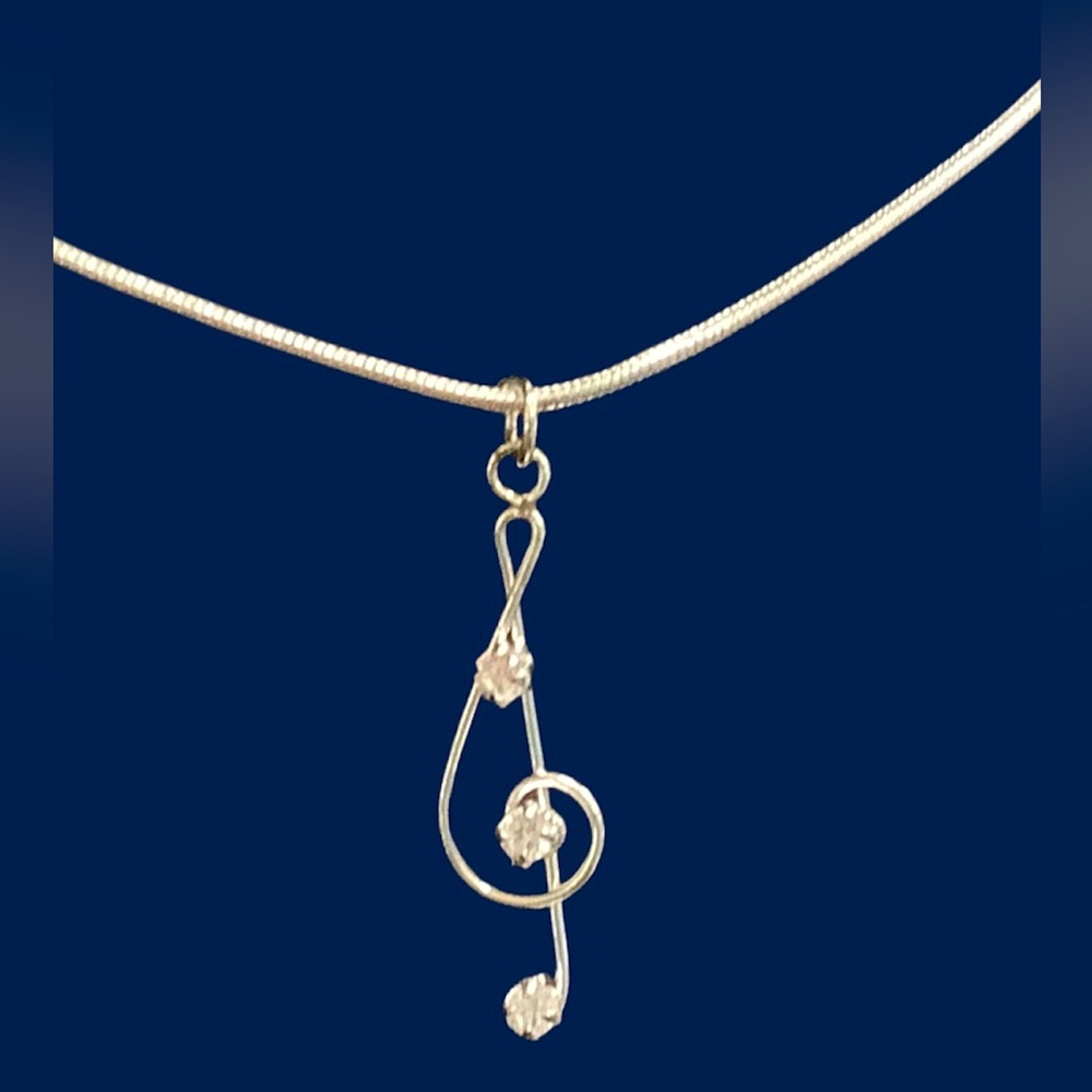 Elegant Silver Treble Clef Necklace with CZ Accents. NWT